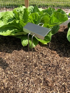 Collector Series L-Style marker in a garden