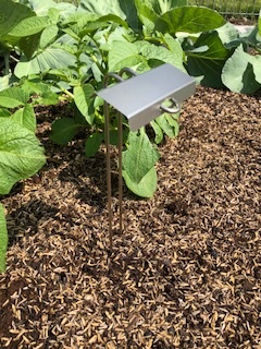 Signature Series P-Style marker in a garden